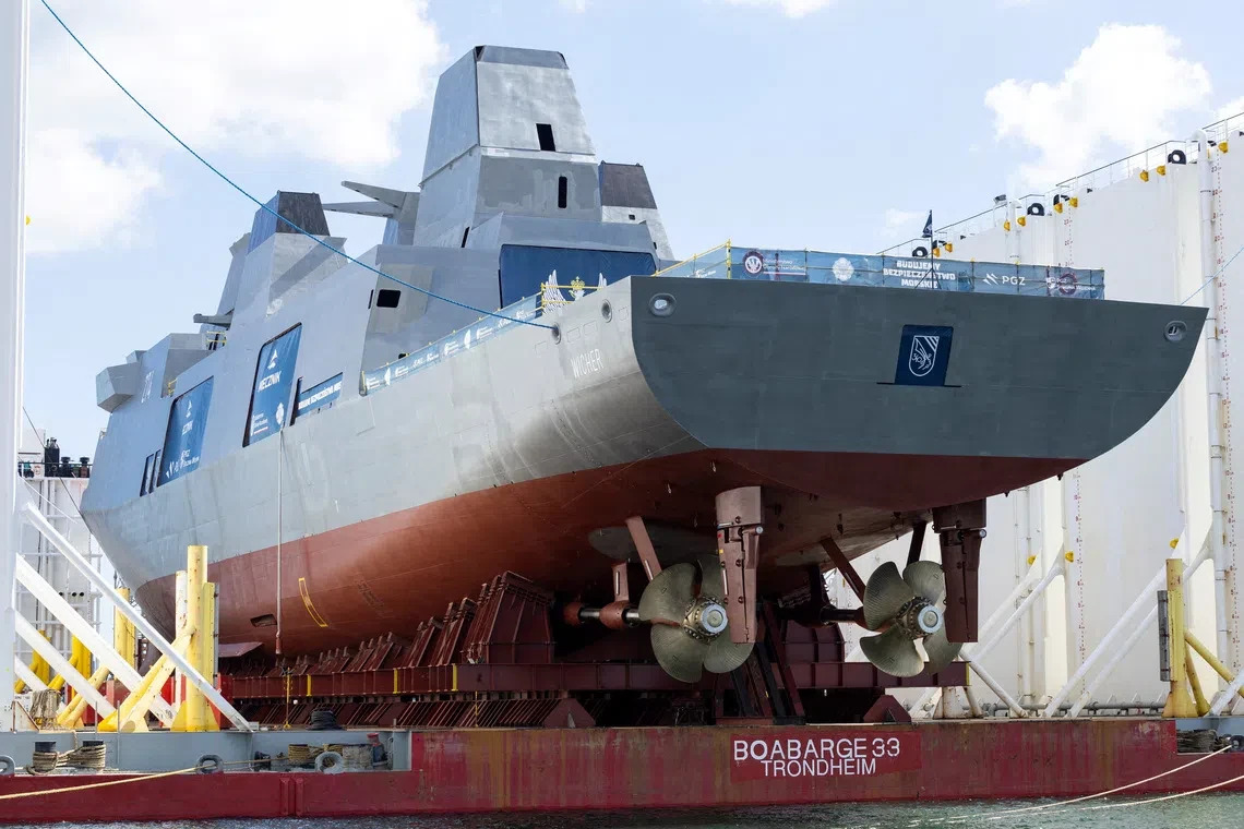 Polish Navy frigate ORP Wicher sits on a semi-submersible barge, following the christening and naming ceremony, marking the official start of the launch operation of the ship, in Gdynia, Poland, August 12, 2026. Photy by Mateusz Kaczmarek/REUTERS